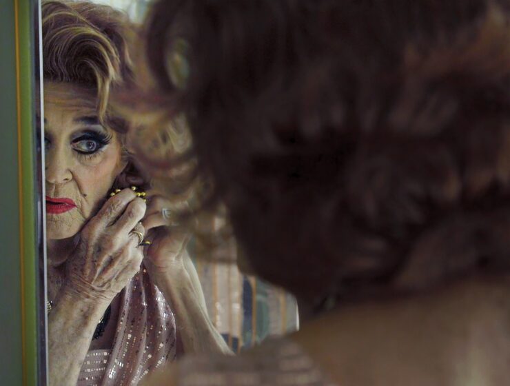 PS Burn This Letter Please LGBT documentary still, showing an ageing drag queen's reflection in the mirror