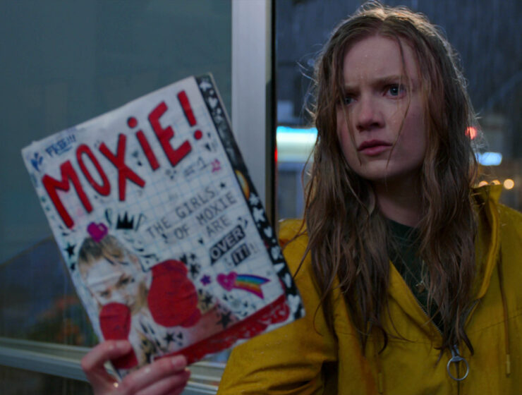Hadley Robinson as Vivian in the rain, in Moxie, Netflix film.