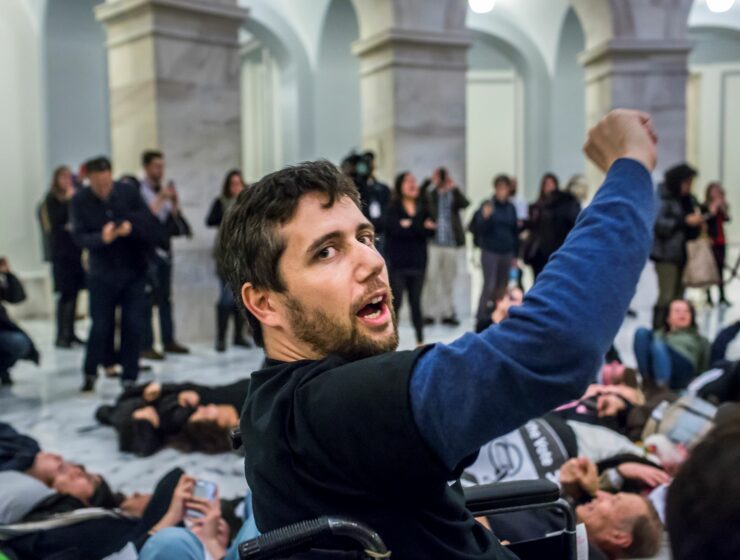 Not Going Quietly documentary by Nicholas Bruckman sees Ady Barkan raising his fist in Capitol Hill