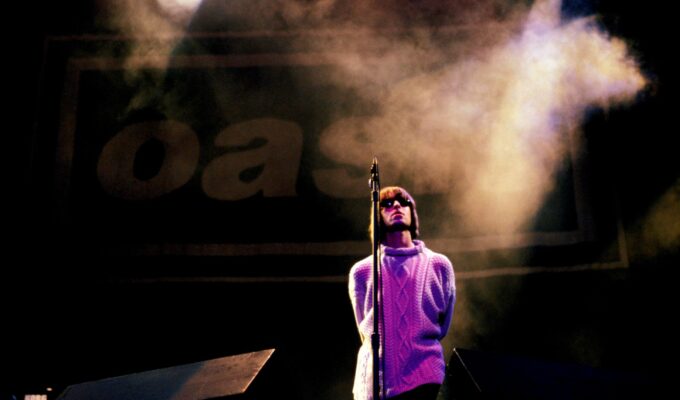 Oasis performing at Knebworth concert in 1996 Britain