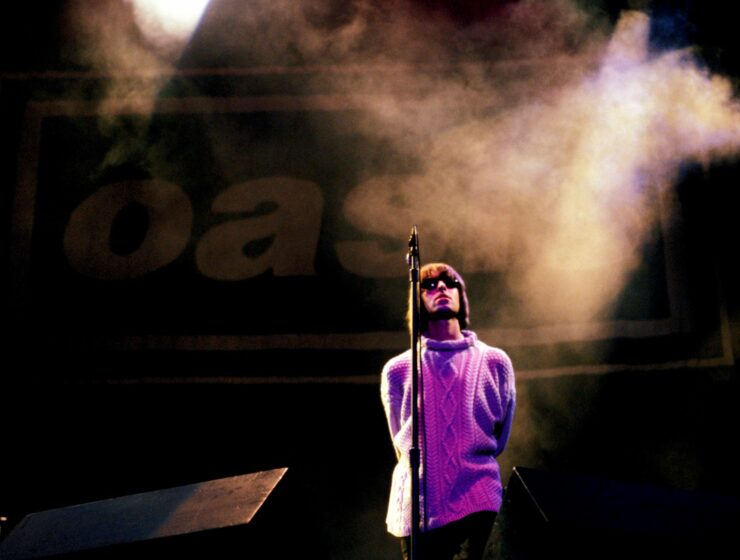 Oasis performing at Knebworth concert in 1996 Britain
