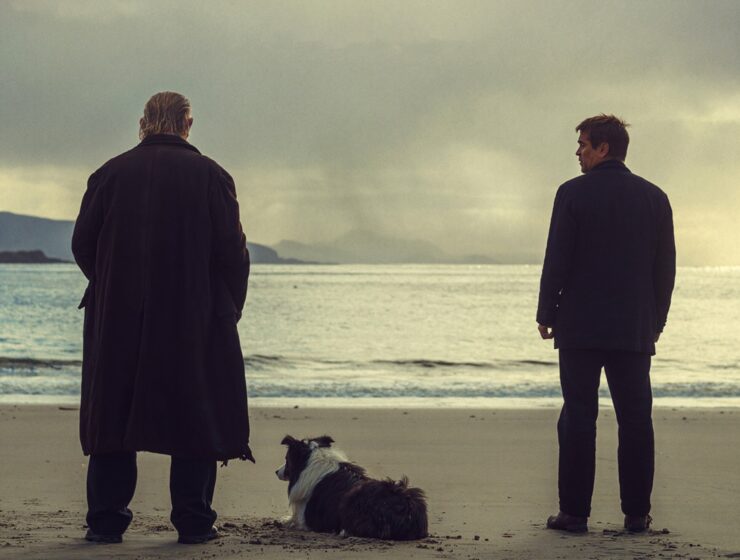 Colin Farrell and Brendan Gleeson on beach looking at sunset in The Banshees of Inisherin